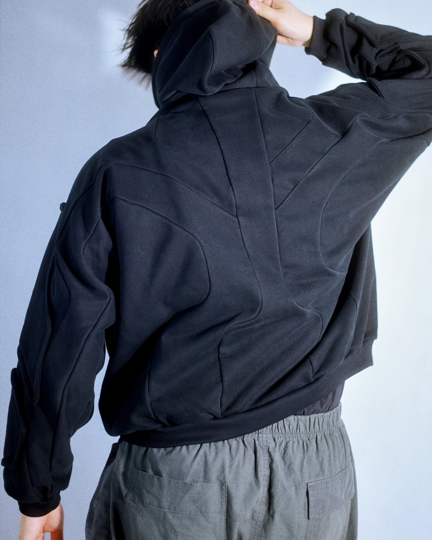 black dark dystopian heavyweight pullover hoodie, back view