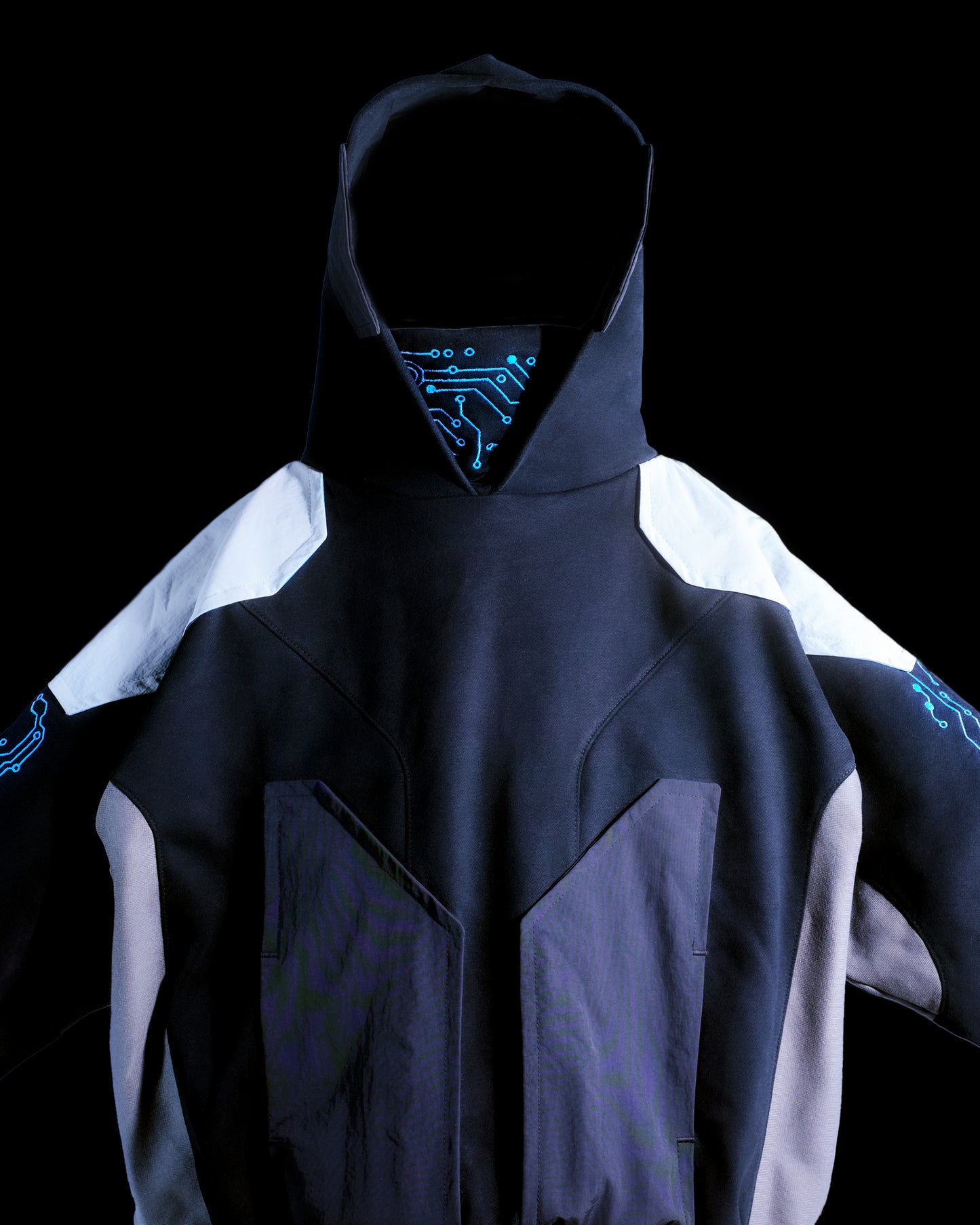 Black hoodie with futuristic grid tech wear style, front close up view