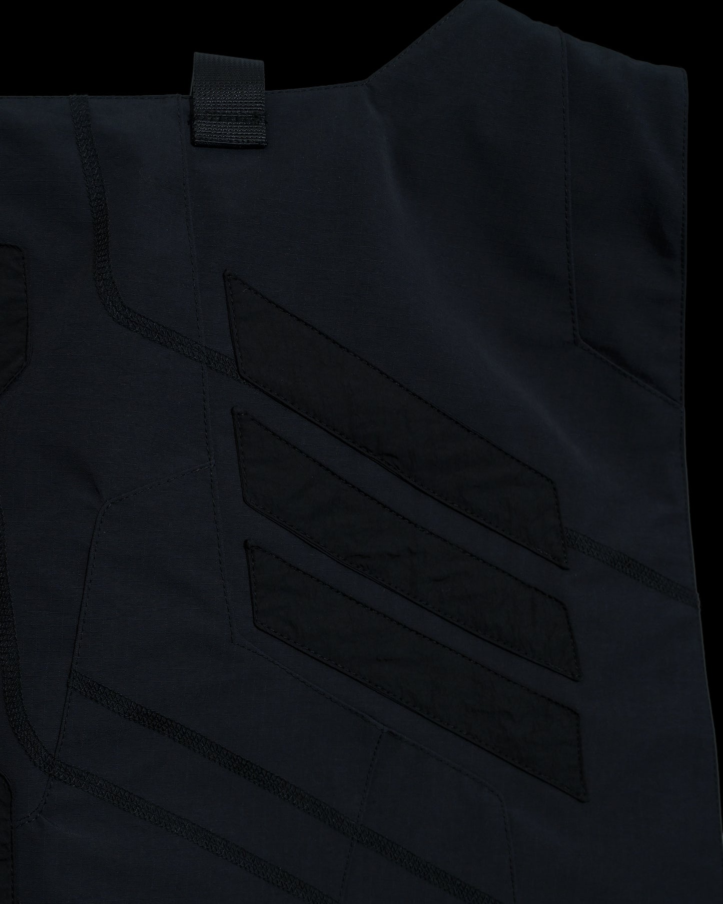 black tactical military dystopian vest, detail close up