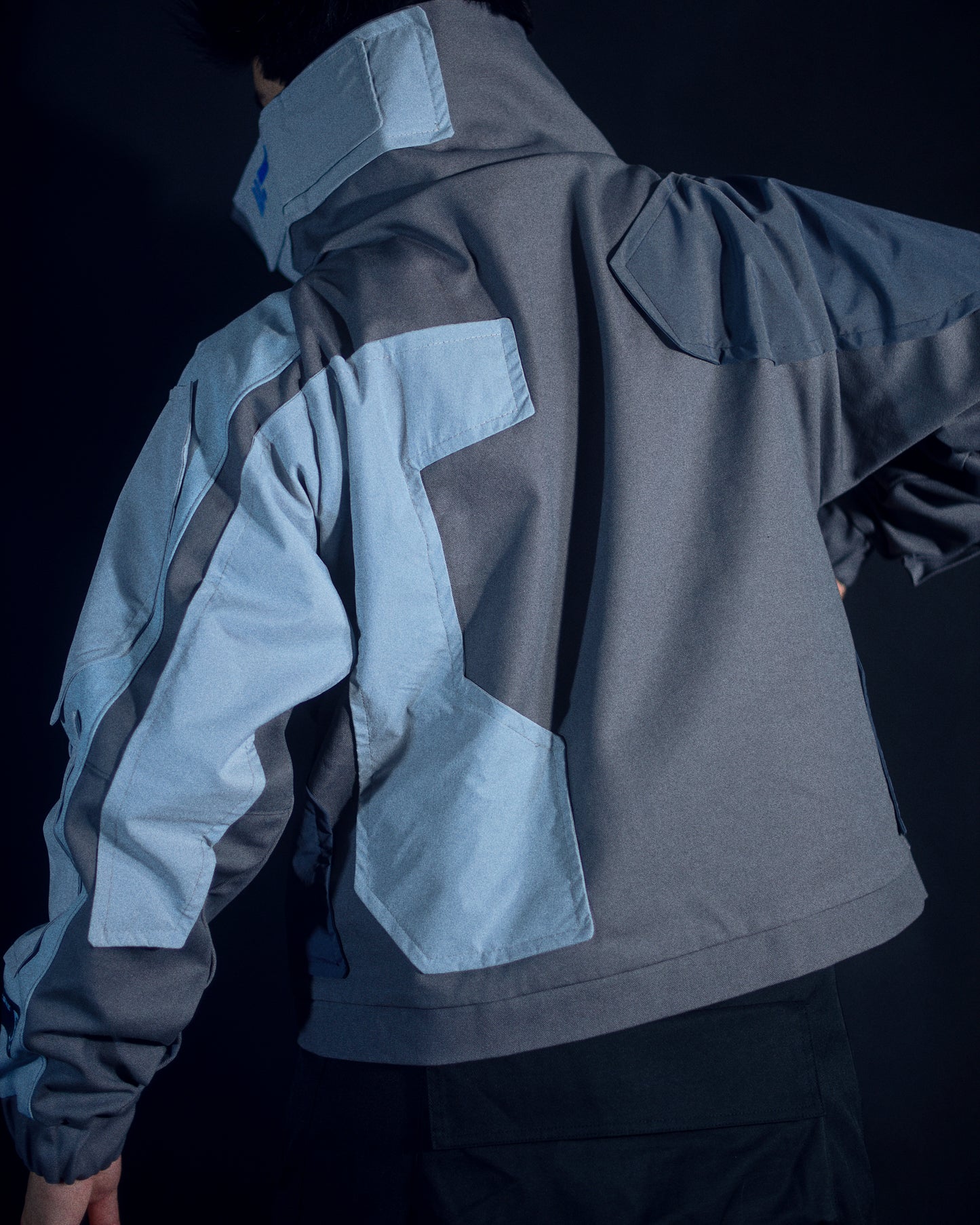 grey cyborg robotic men half zip jacket, back model view
