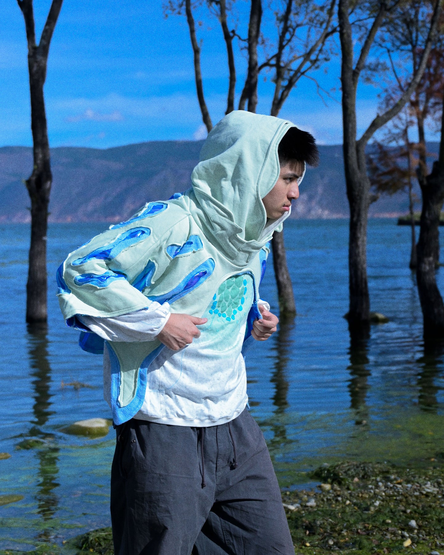 lucid coral aqua sci-fi clothing hoodie, model lake view