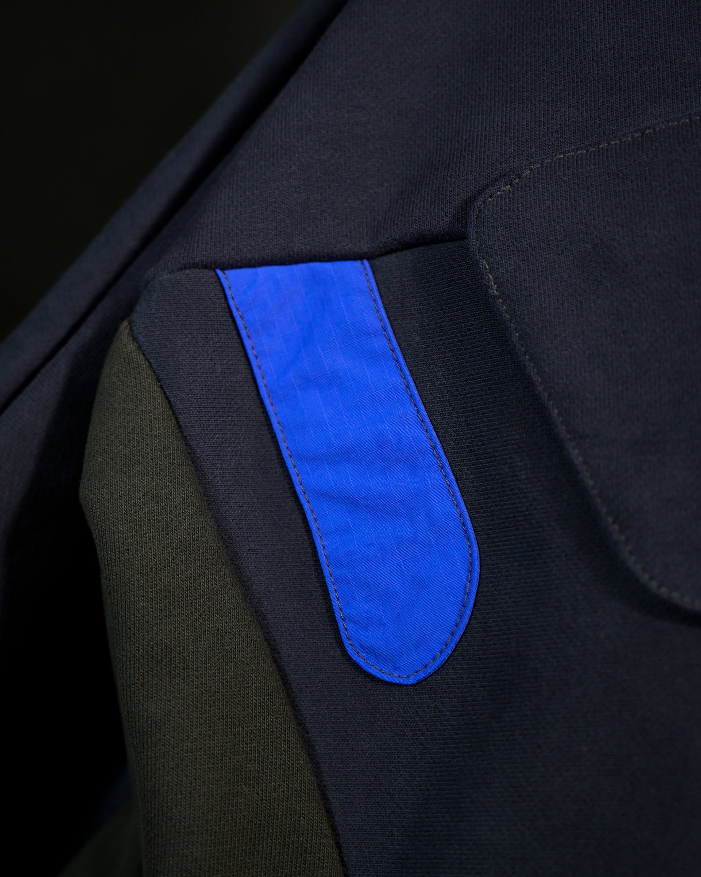 navy android robotic ski hoodie, stitching view