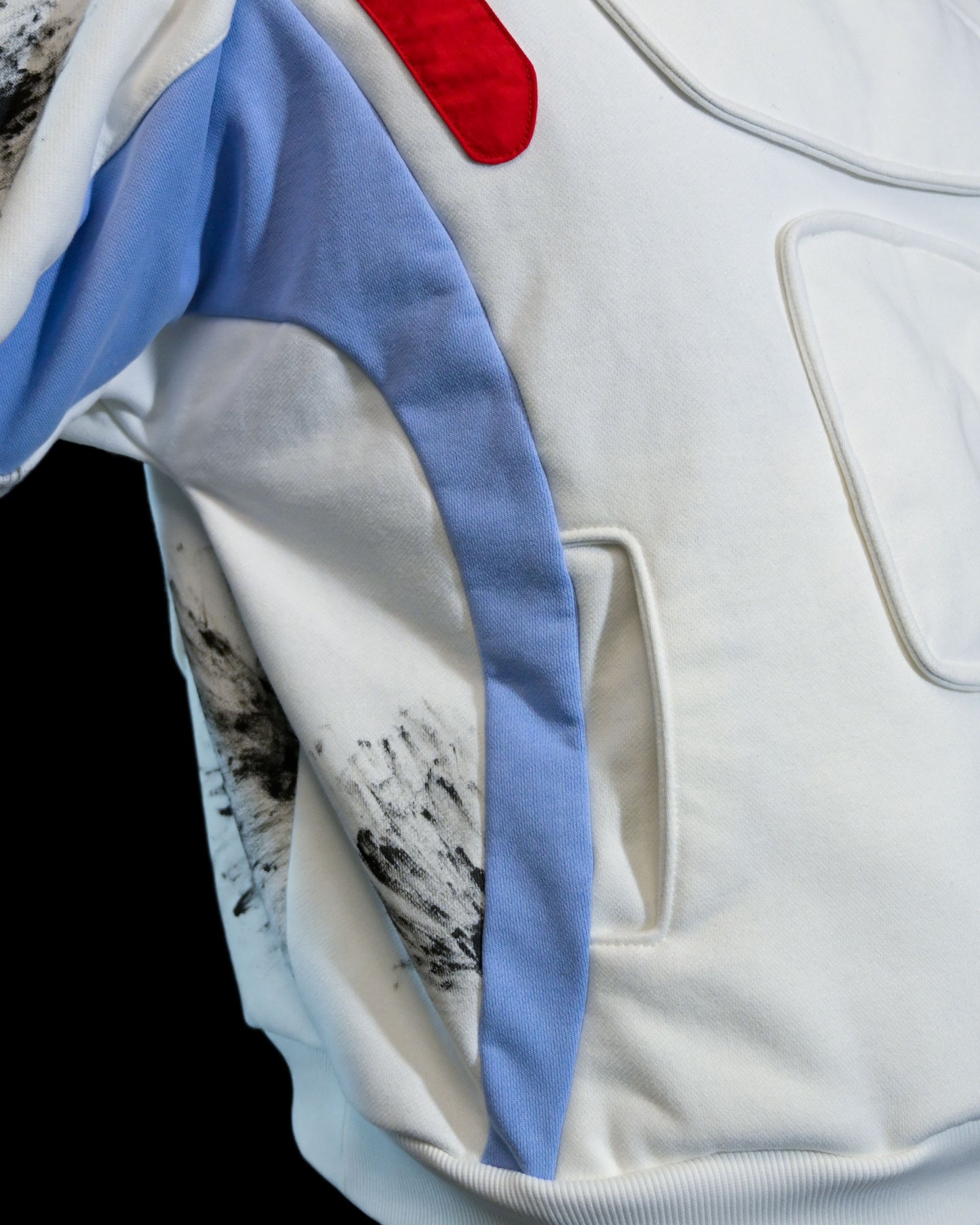 white futuristic cyber core ski jacket, front pockets view