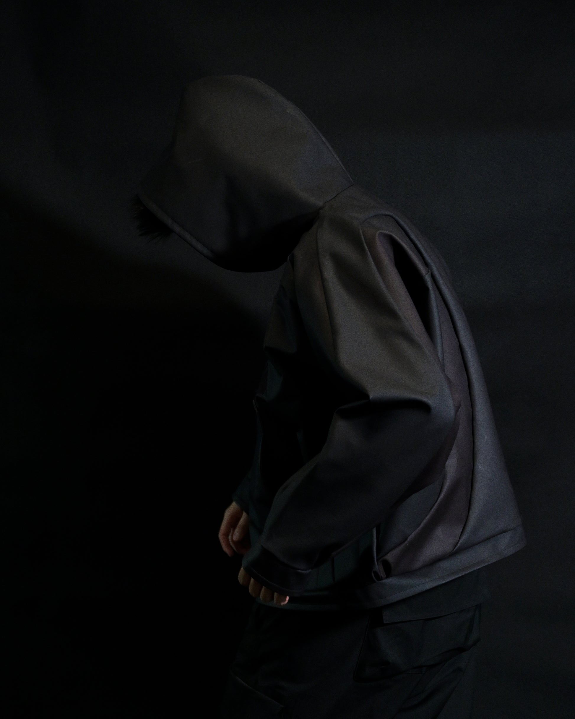 black archive fashion heat reactive leather hoodie, side model view