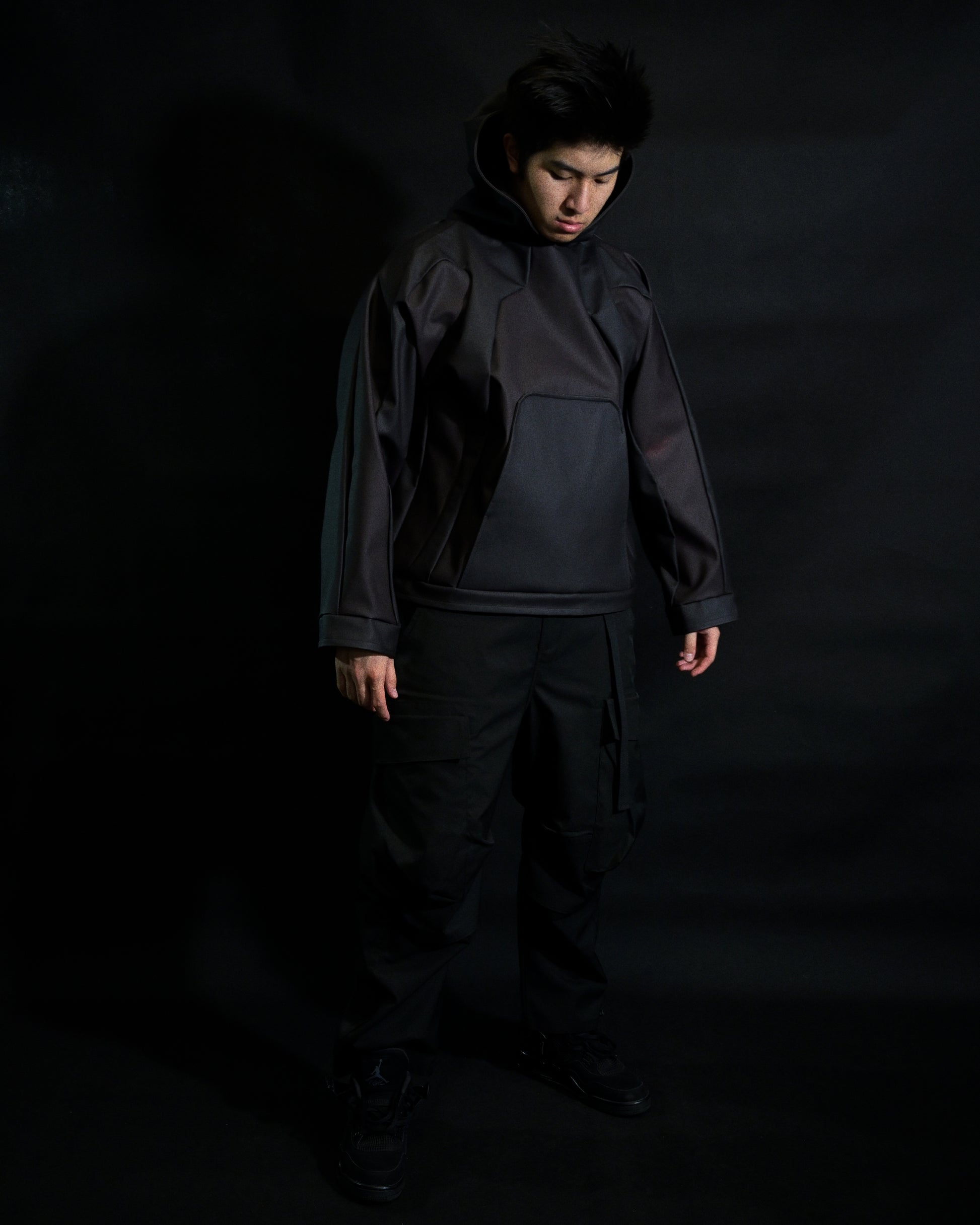 black archive fashion heat reactive leather hoodie, front standing model view