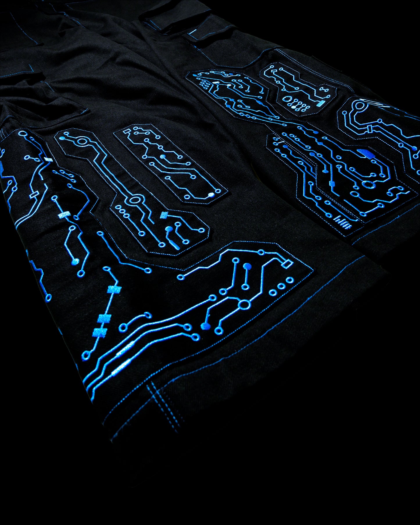 black denim grid futuristic techno circuit cyborg pants, embroidery detail view