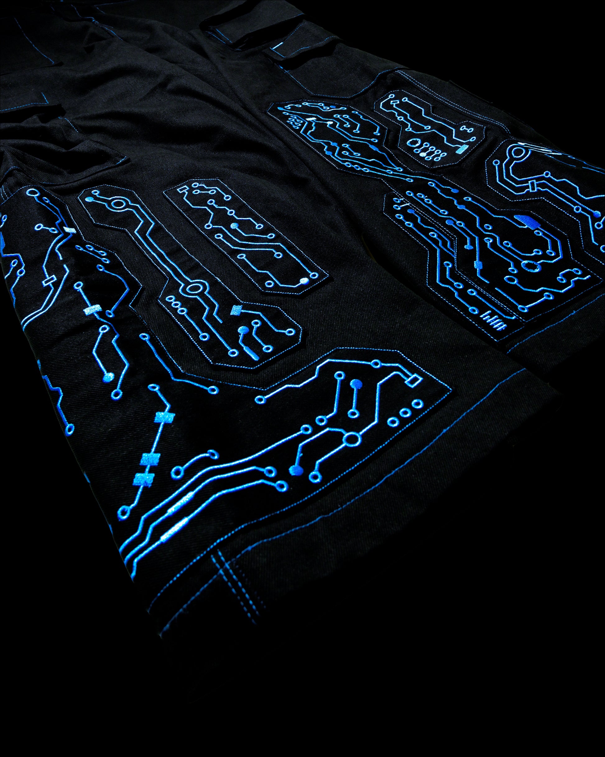 black denim grid futuristic techno circuit cyborg pants, embroidery detail view