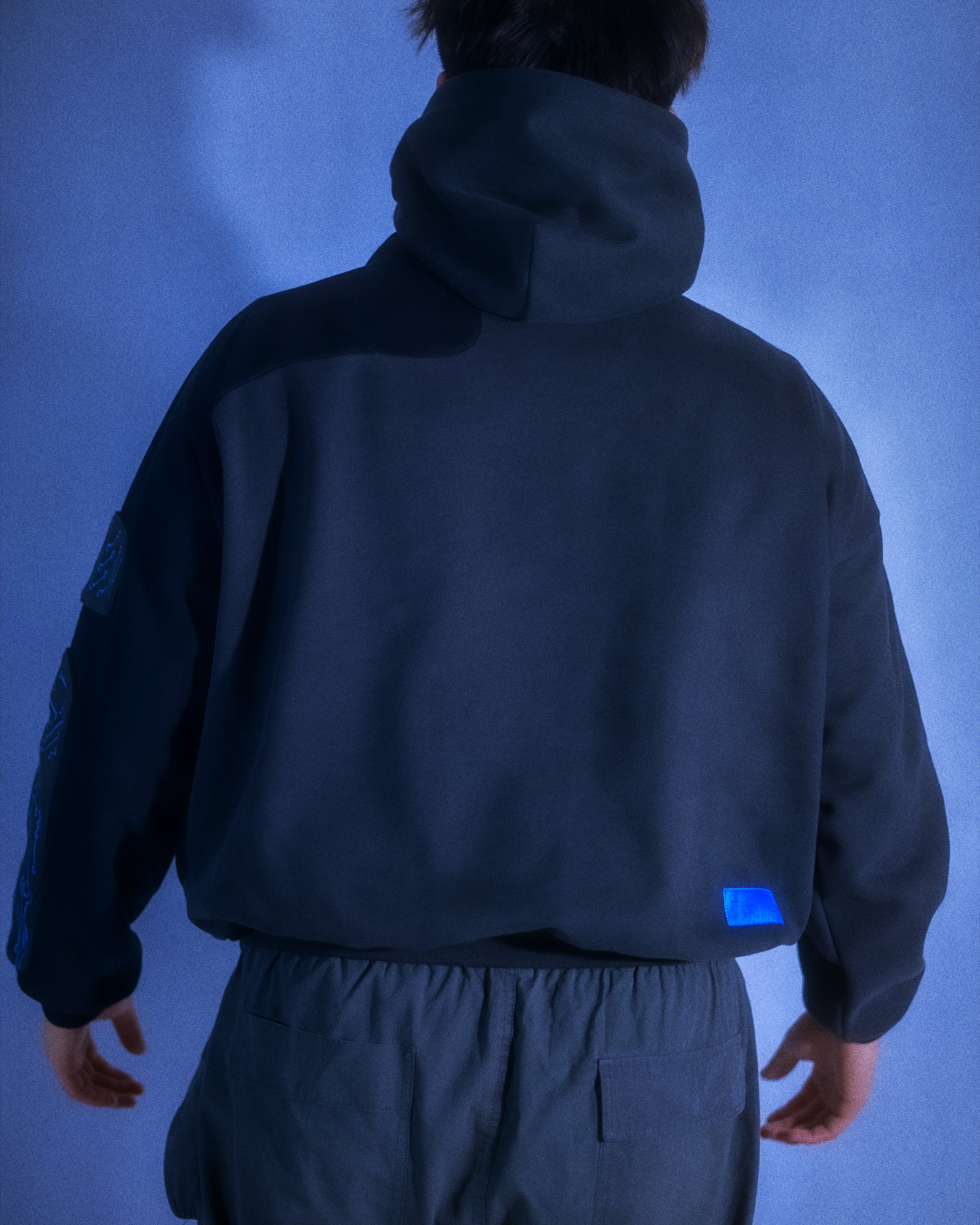 black grid circuit techwear cyberpunk hoodie, back view
