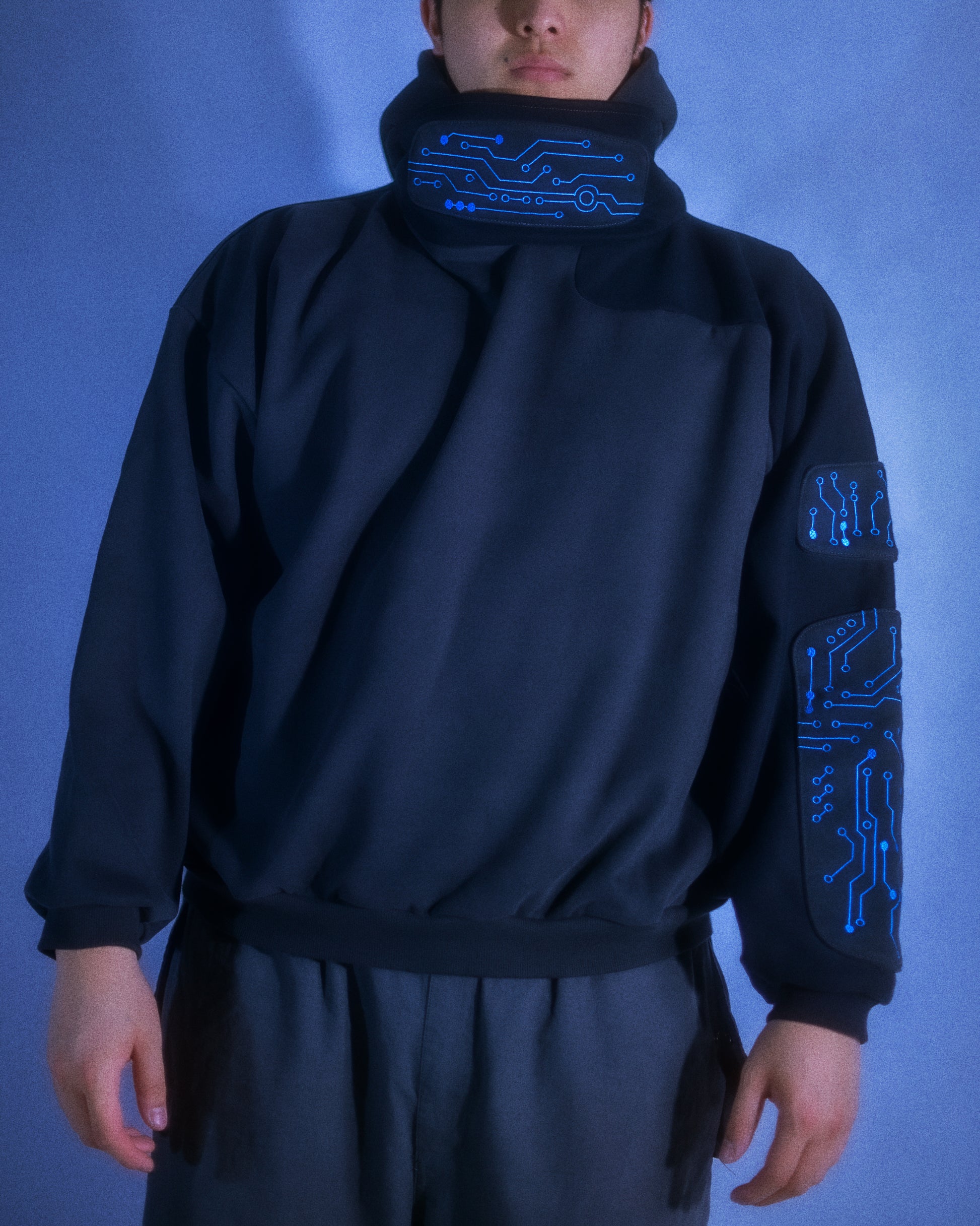 black grid circuit techwear cyberpunk hoodie, front model view