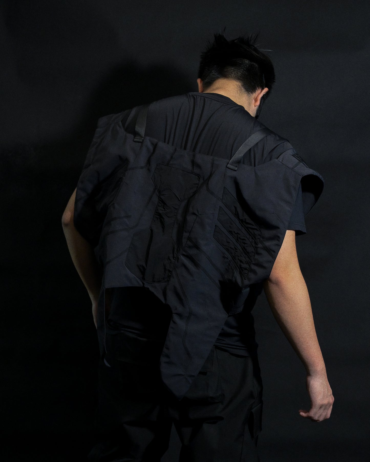 black tactical military dystopian vest, back model view