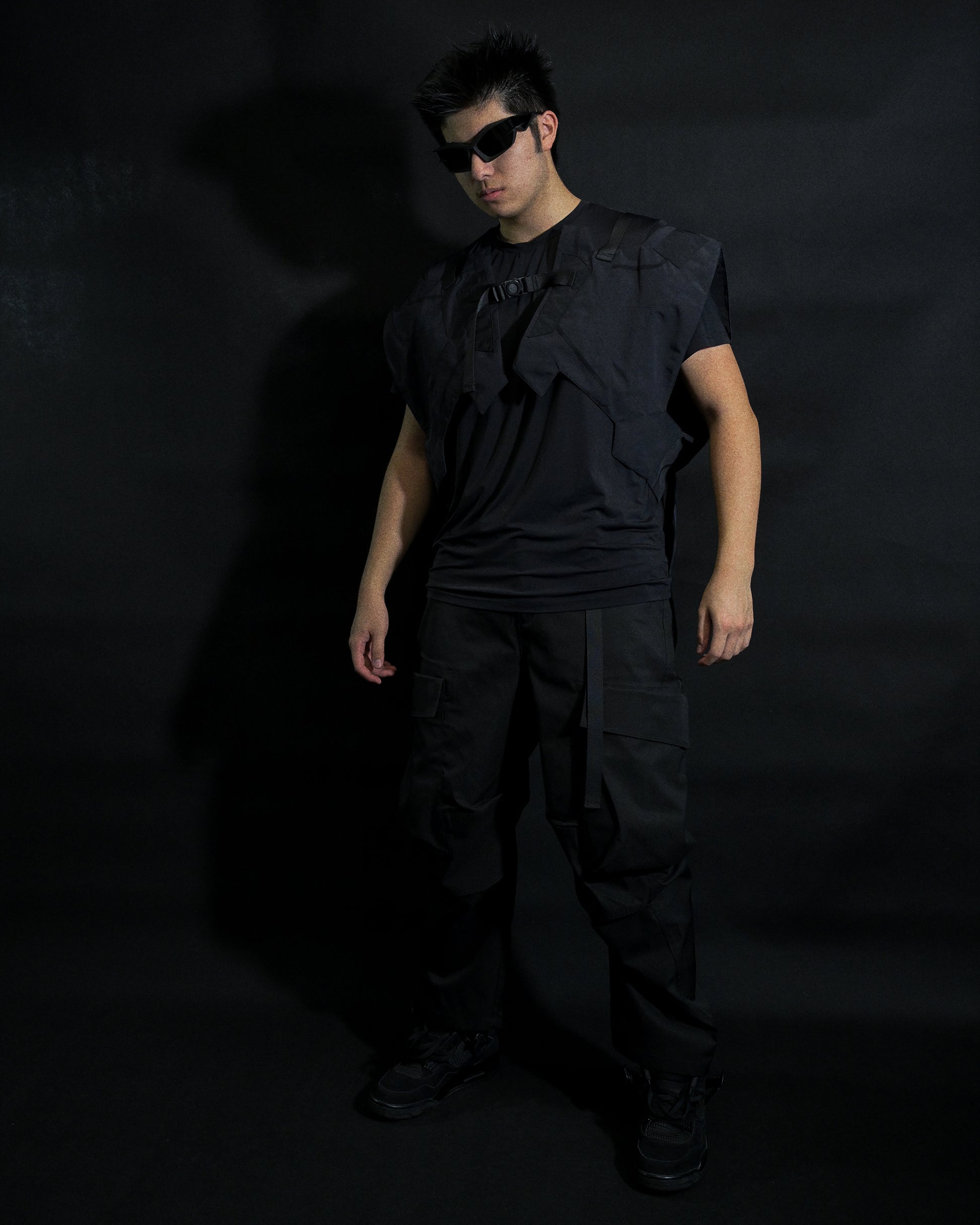 black tactical military dystopian vest, front standing model view