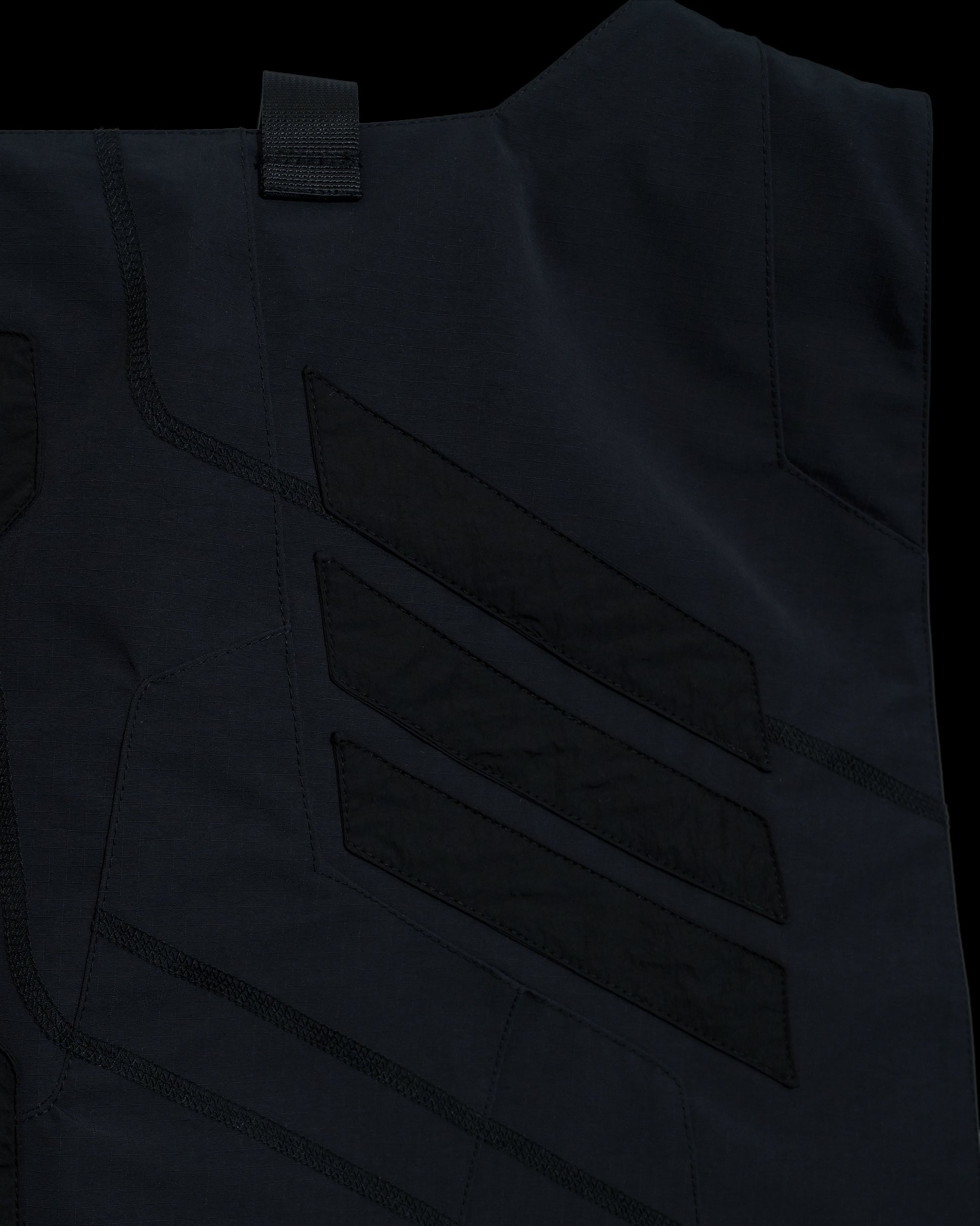 black tactical military dystopian vest, detail close up