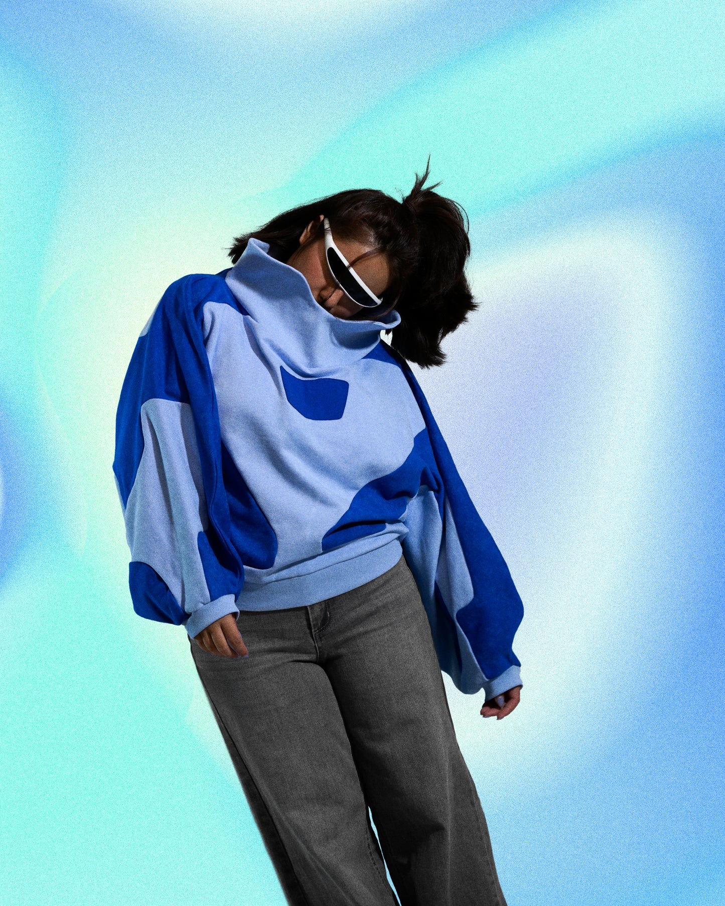 blue artificial love cybercore women's cropped sweater, front model leaning view