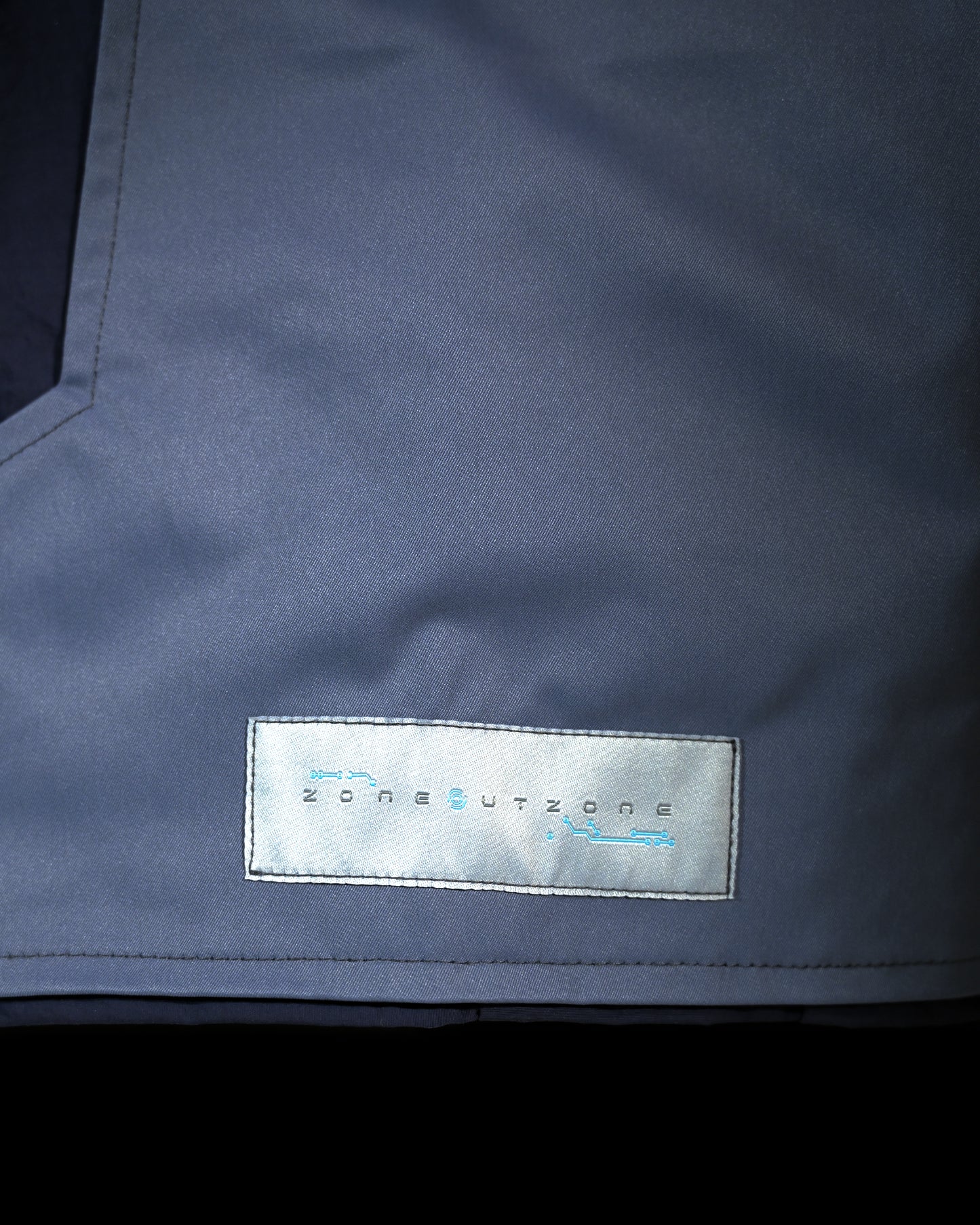 blue techno techwear cyberspace pants, woven tag view