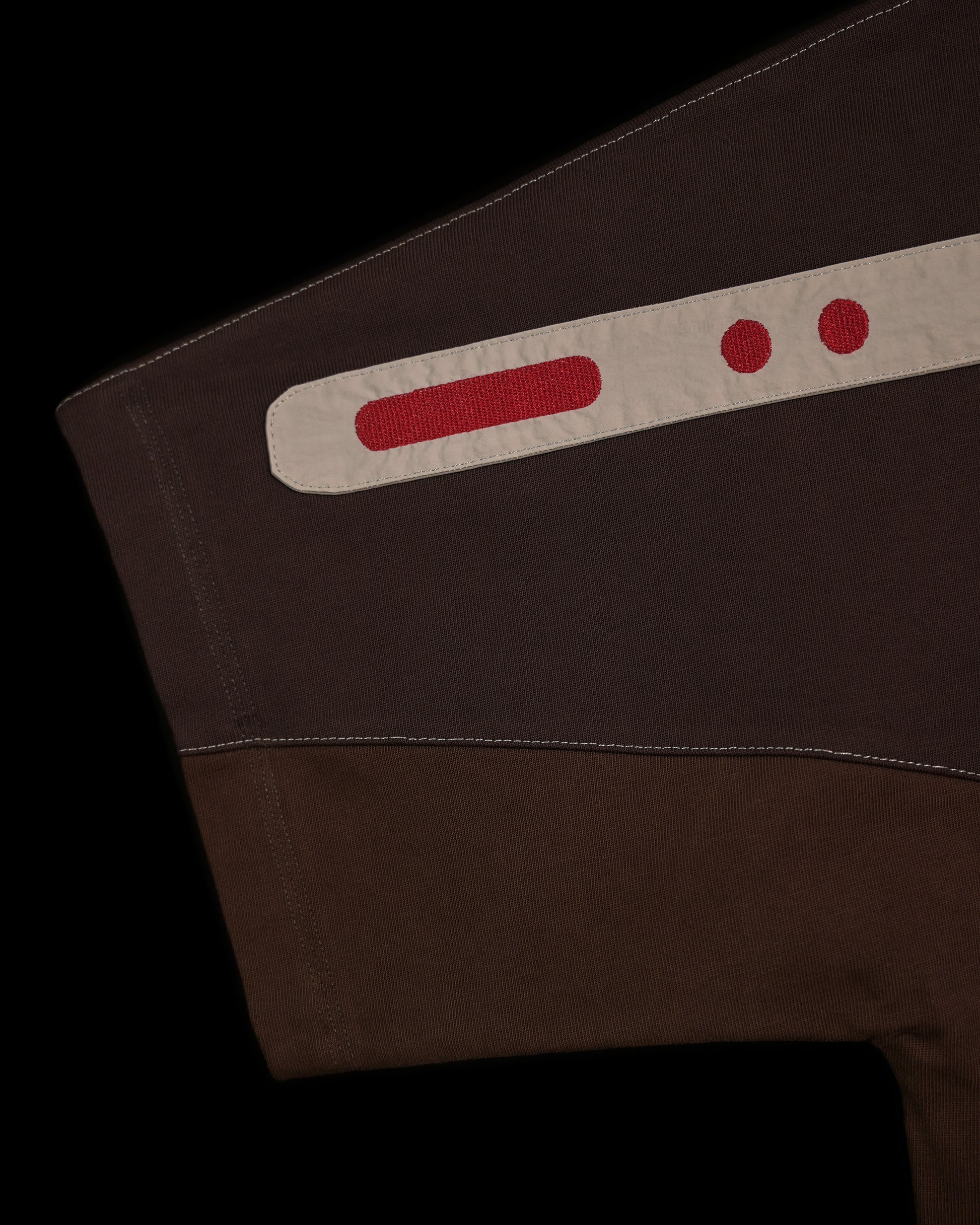 brown earth tone industrial terrain tee, stitching detail view