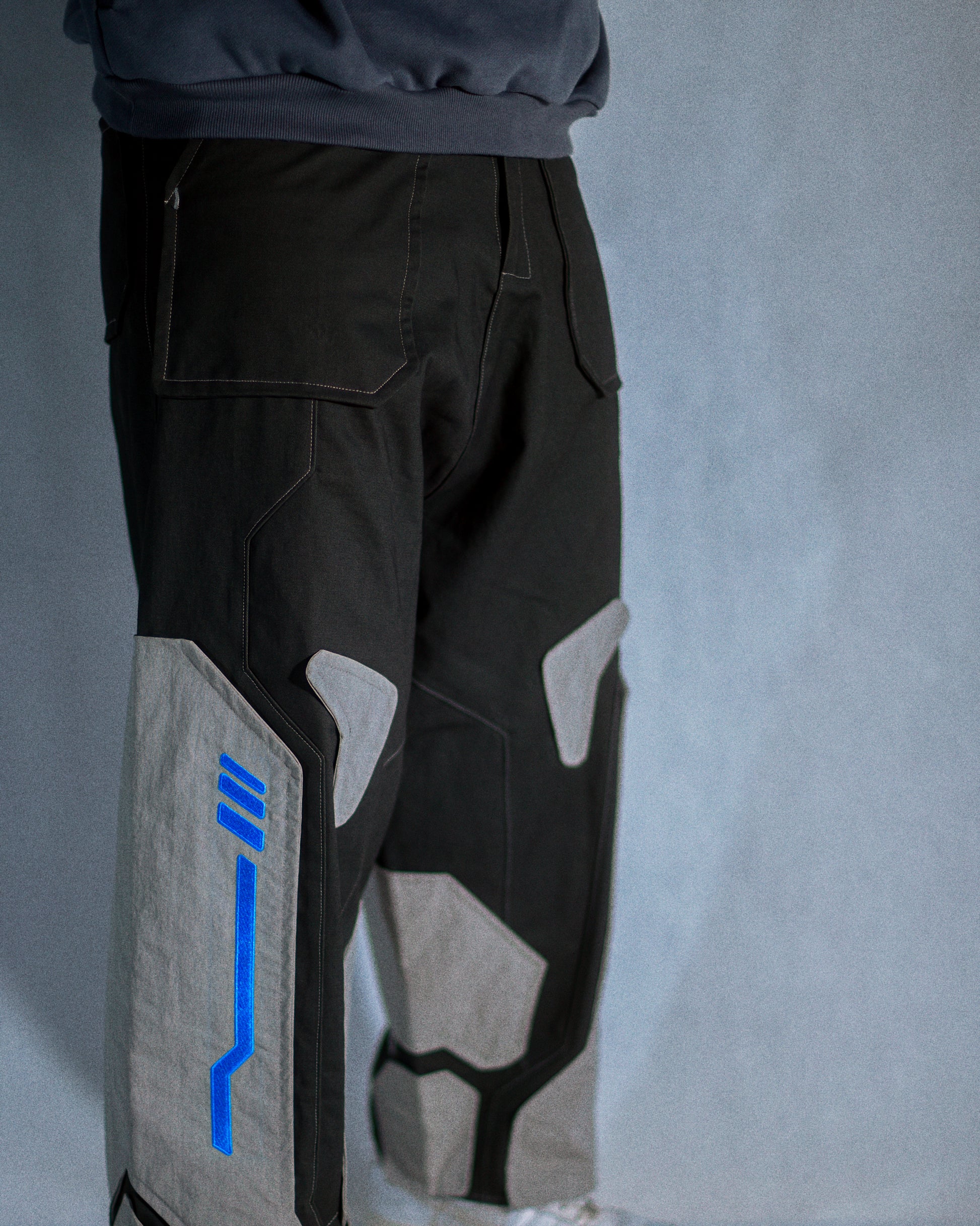brown grey modular retro futuristic pants, model view