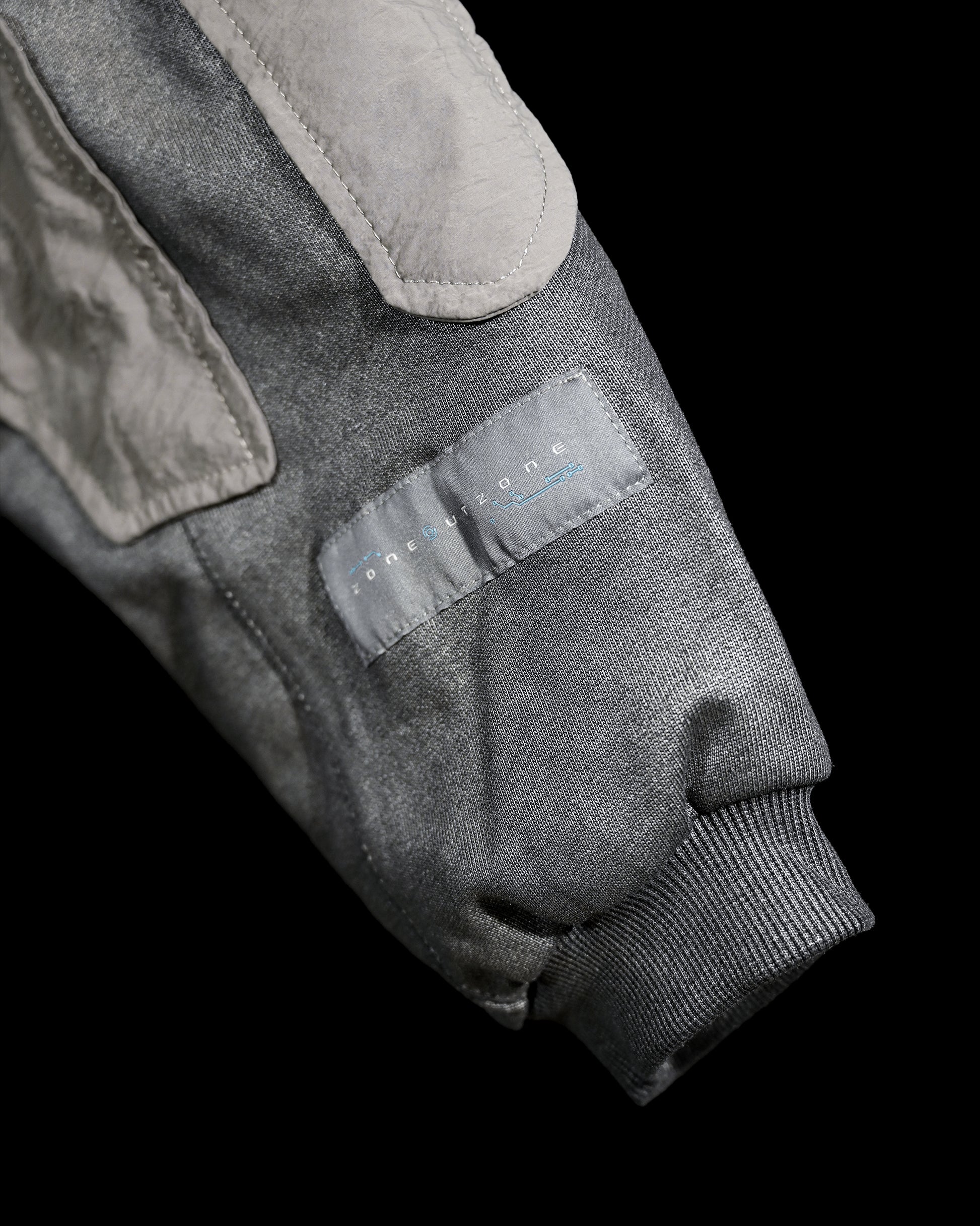 chrome alien sci-fi ufo extraterrestrial archive hoodie, sleeve woven tag view