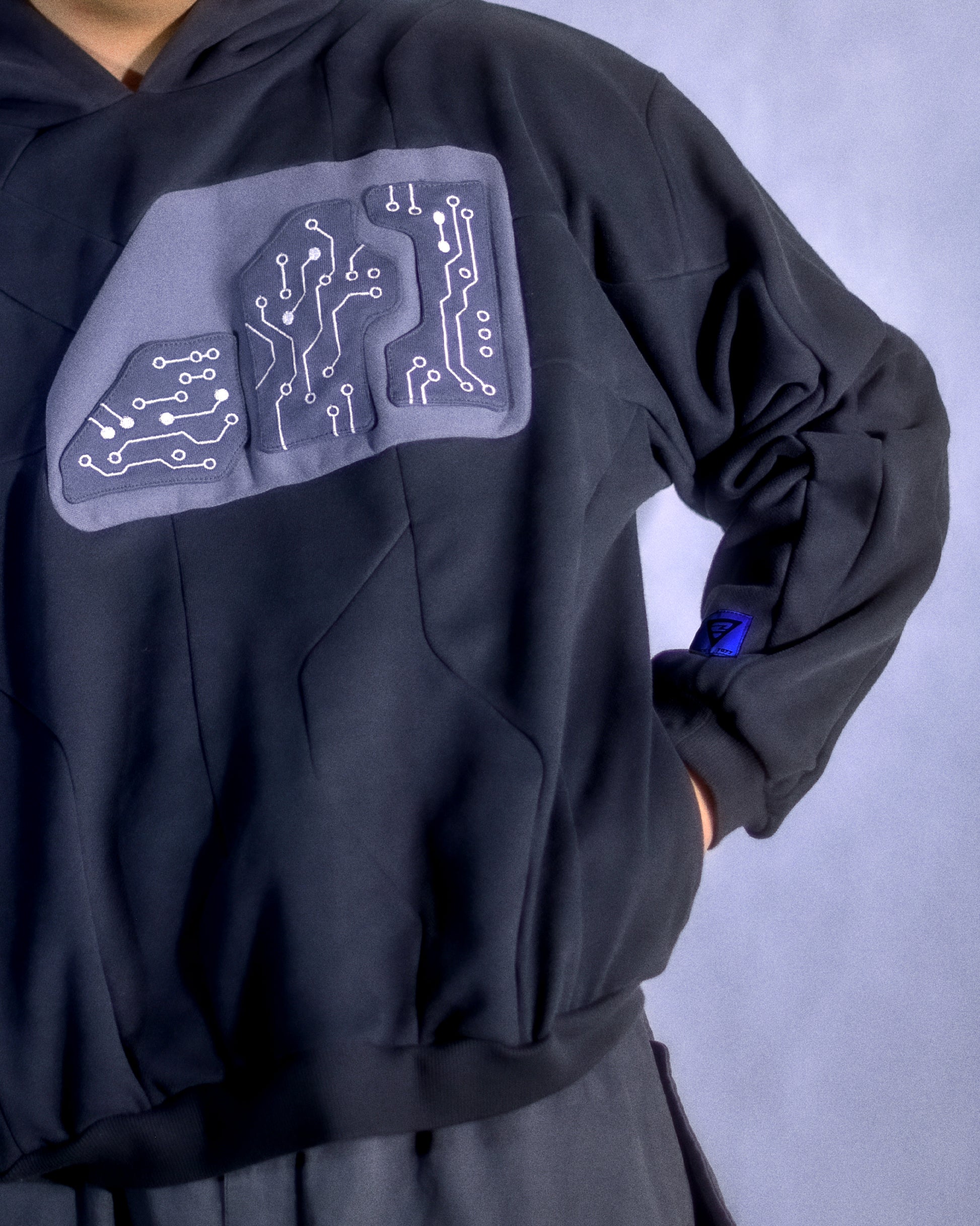 Dark grey hoodie circuit grid futuristic streetwear hoodie, front model view