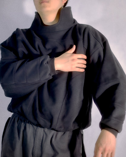 dark grey cyberspace metaverse alien sweater, front model view