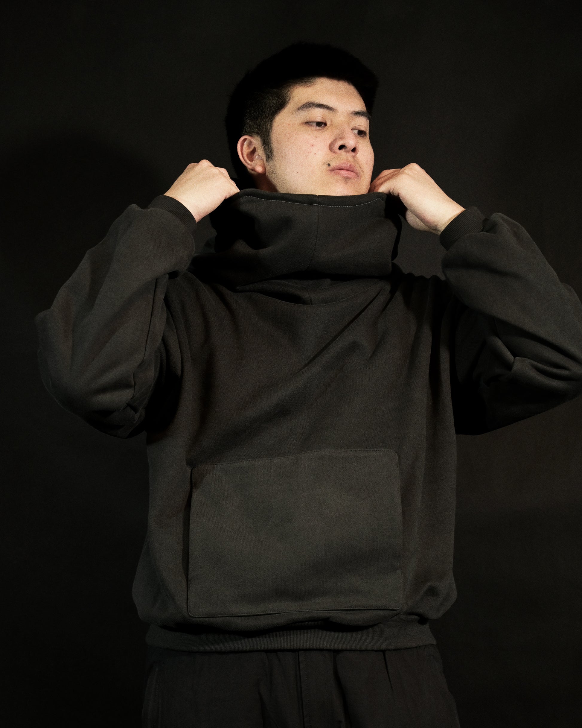 dark grey galactic sci-fi blank streetwear hoodie, model view