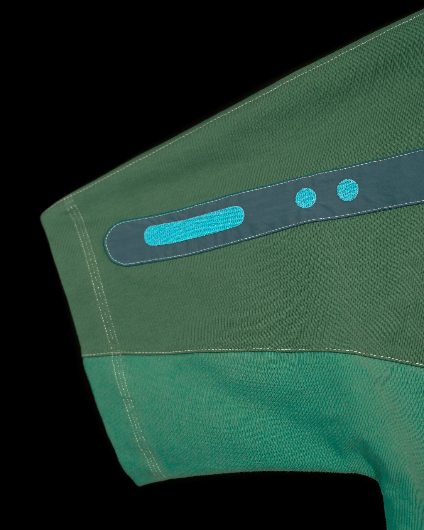 green emerald terraforming earth tone tee, embroidery detail view