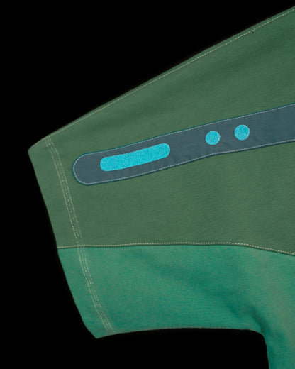 green emerald terraforming earth tone tee, embroidery detail view