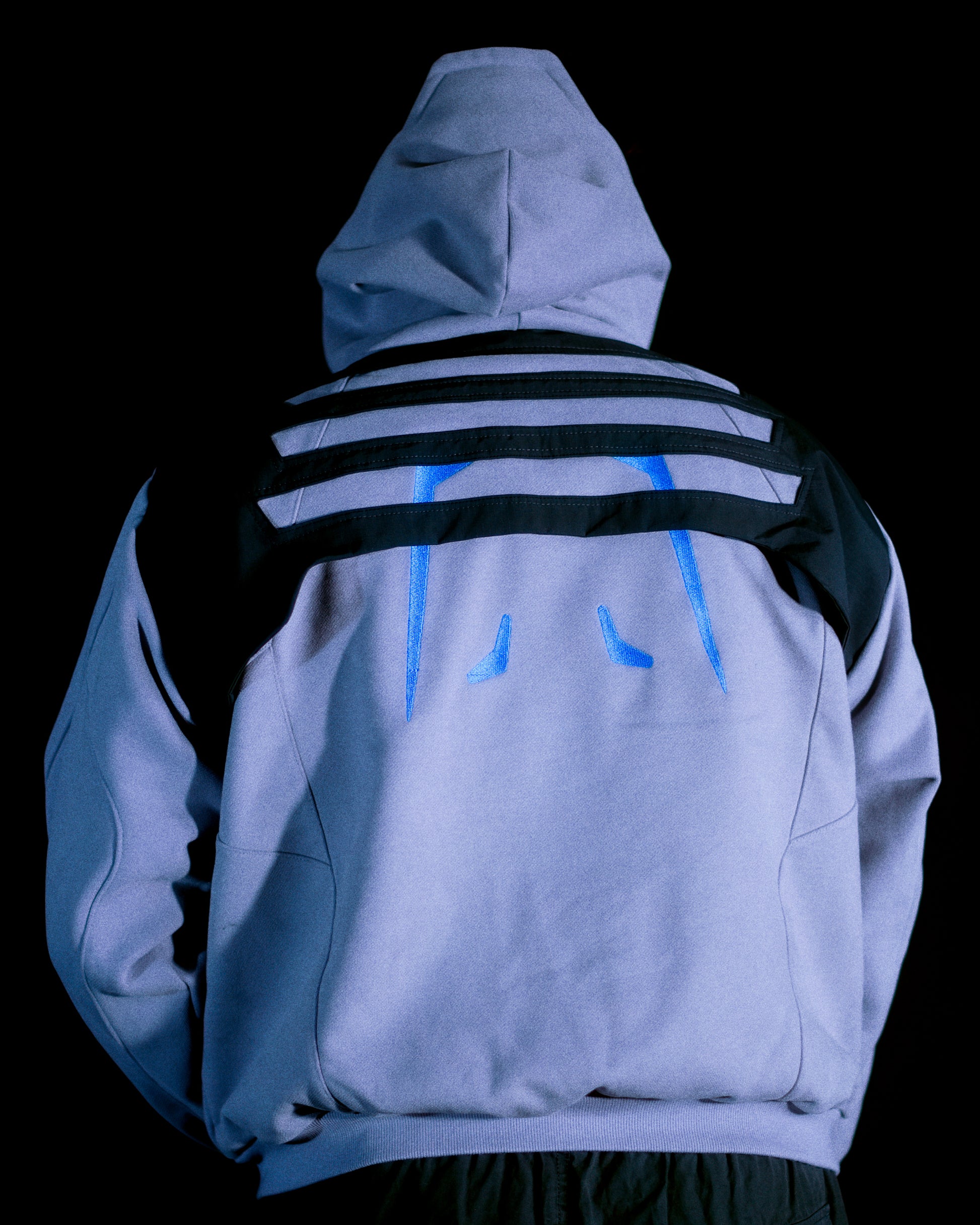Grey hoodie with tech wear details, back model view