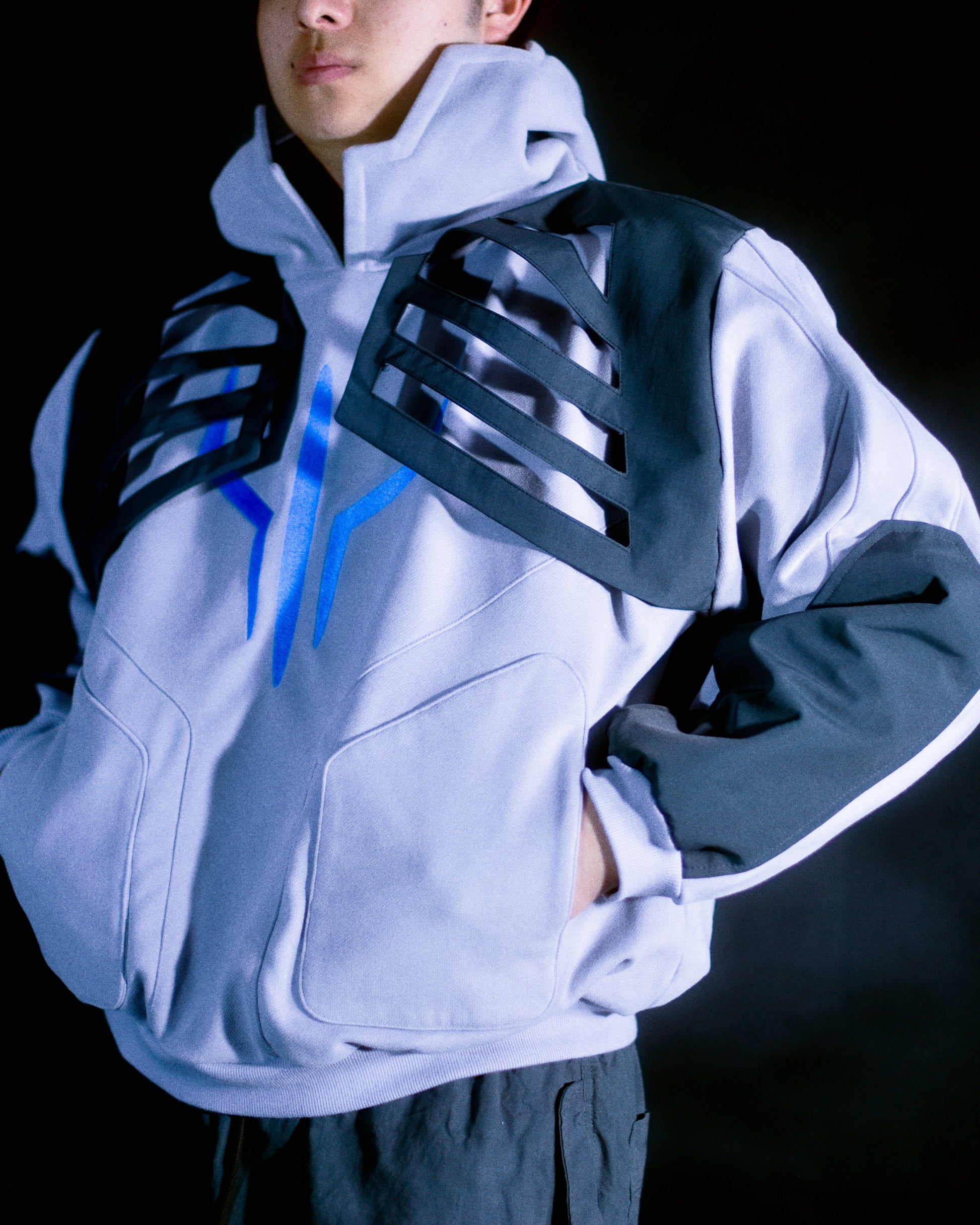 Grey hoodie with tech wear details, front model view