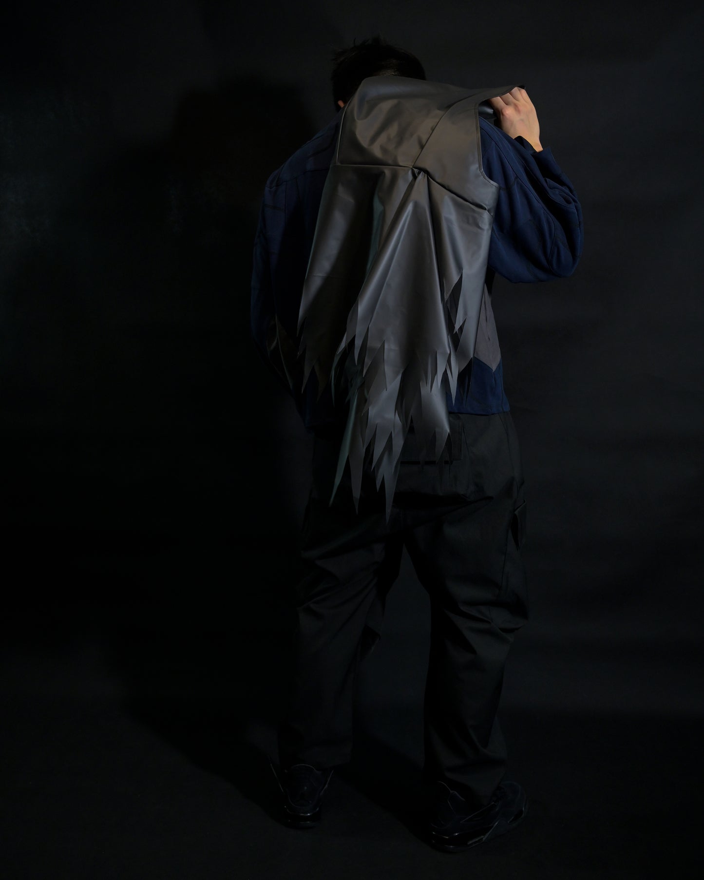navy cloaking experimental sci-fi jacket, back standing view