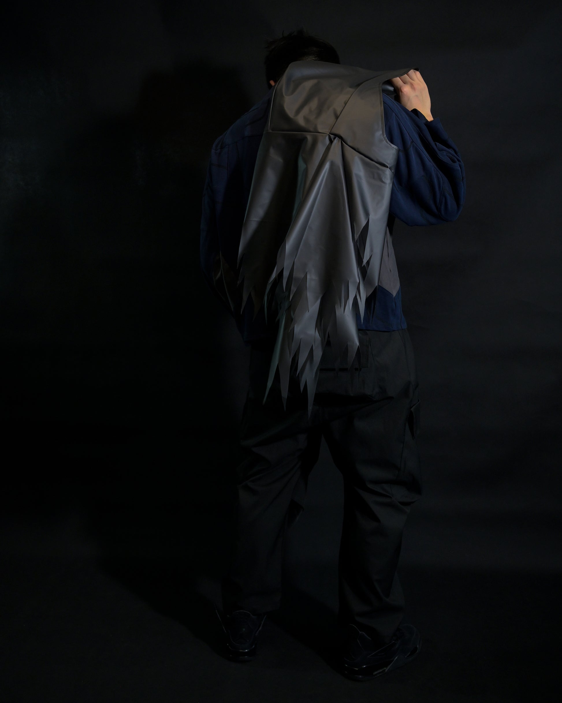 navy cloaking experimental sci-fi jacket, back standing view