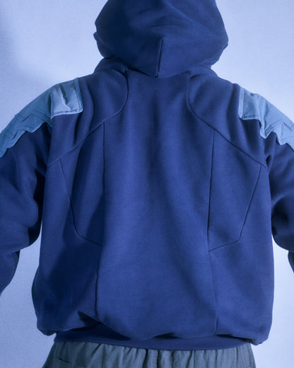 Navy hoodie with cyberpunk armor details, back model view